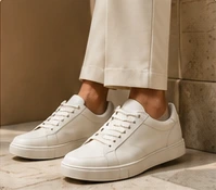 White sneakers with cream trousers